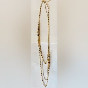 Elegant layered gold chain necklace with marbled accent beads